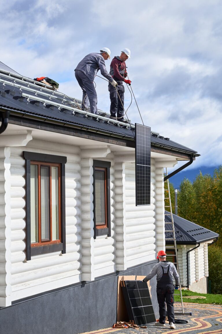workers-lifting-up-photovoltaic-solar-module-while-2025-01-16-22-17-46-utc